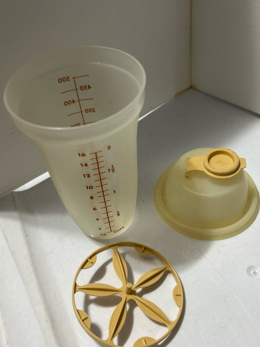 Tupperware Translucent Cream Measuring Cup with Yellow Lid and Insert